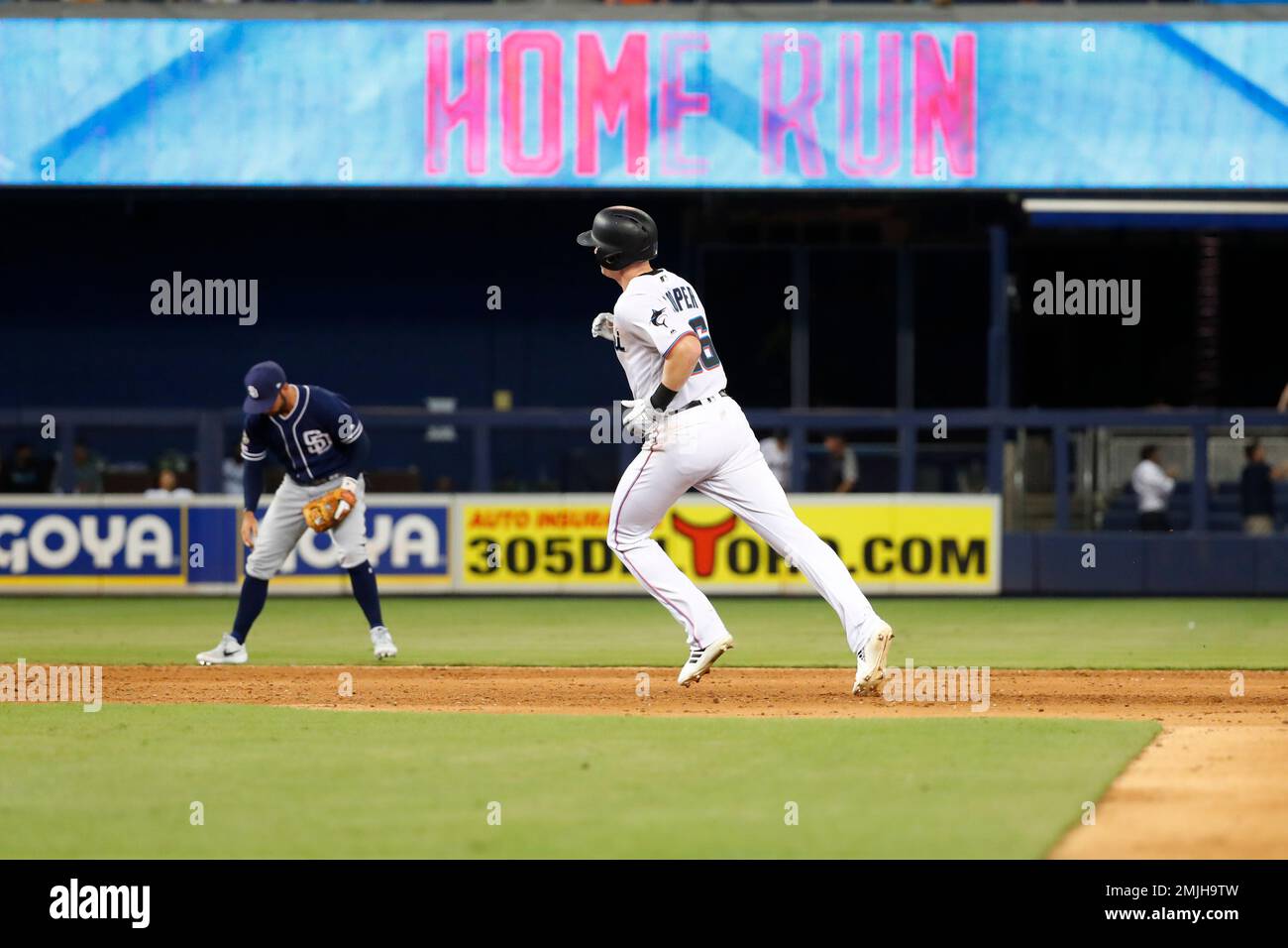 Garrett Cooper of the Miami Marlins singles during the third