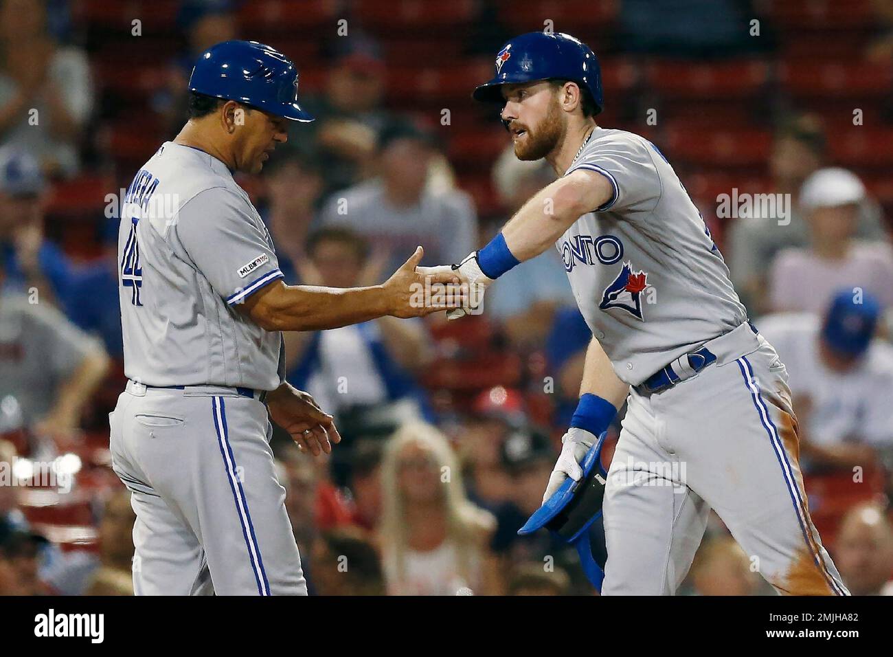 Toronto Blue Jays' Billy McKinney celebrates his triple with third base
