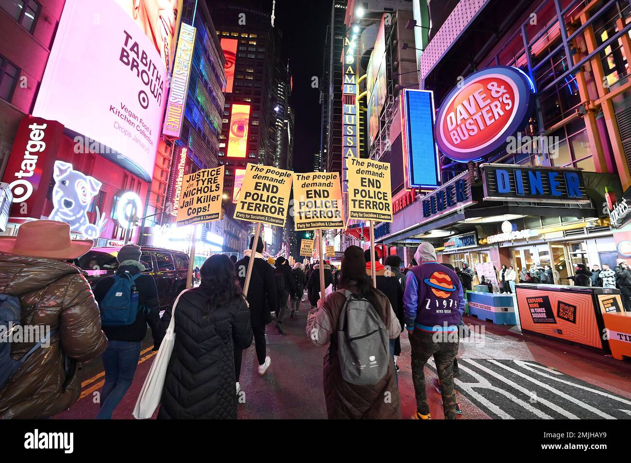New York, USA. 27th Jan, 2023. Demonstrators hold signs as they march through Times Square in protest sparked by the release of the Tyre Nichols fatal beating video, New York, NY, January 27, 2023. The release of a video depicting the fatal beating of Nichols, a 29-year-old African-American man by 5 African-American Memphis Police officers set off protests in NYC and other cities throughout the country. (Photo by Anthony Behar/Sipa USA) Credit: Sipa USA/Alamy Live News Stock Photo