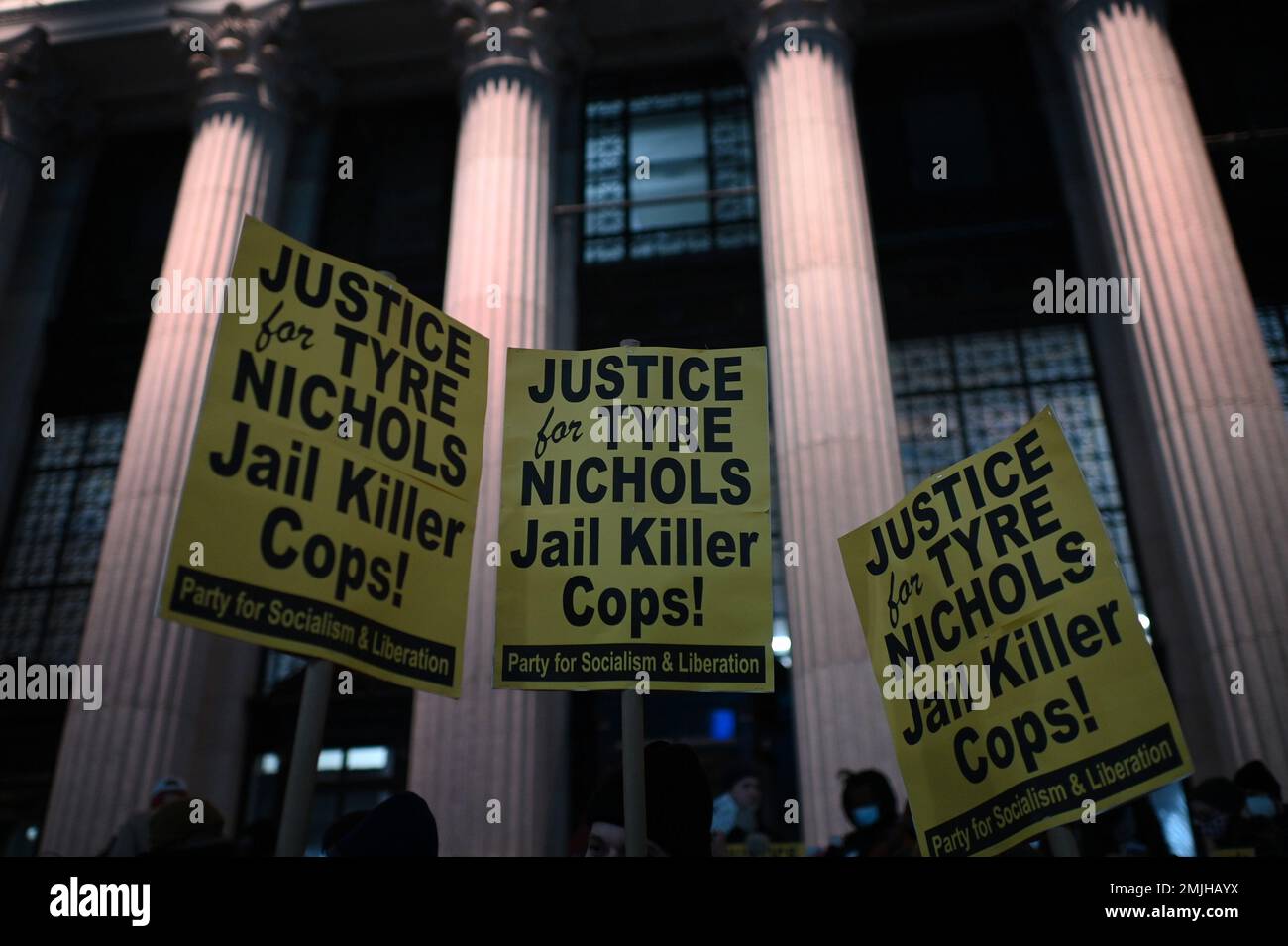 New York, USA. 27th Jan, 2023. Demonstrators hold signs as they stand outside the James A Farley Post office along 8th Avenue during protest sparked by the release of the Tyre Nichols fatal beating video, New York, NY, January 27, 2023. The release of a video depicting the fatal beating of Nichols, a 29-year-old African-American man by 5 African-American Memphis Police officers set off protests in NYC and other cities throughout the country. (Photo by Anthony Behar/Sipa USA) Credit: Sipa USA/Alamy Live News Stock Photo