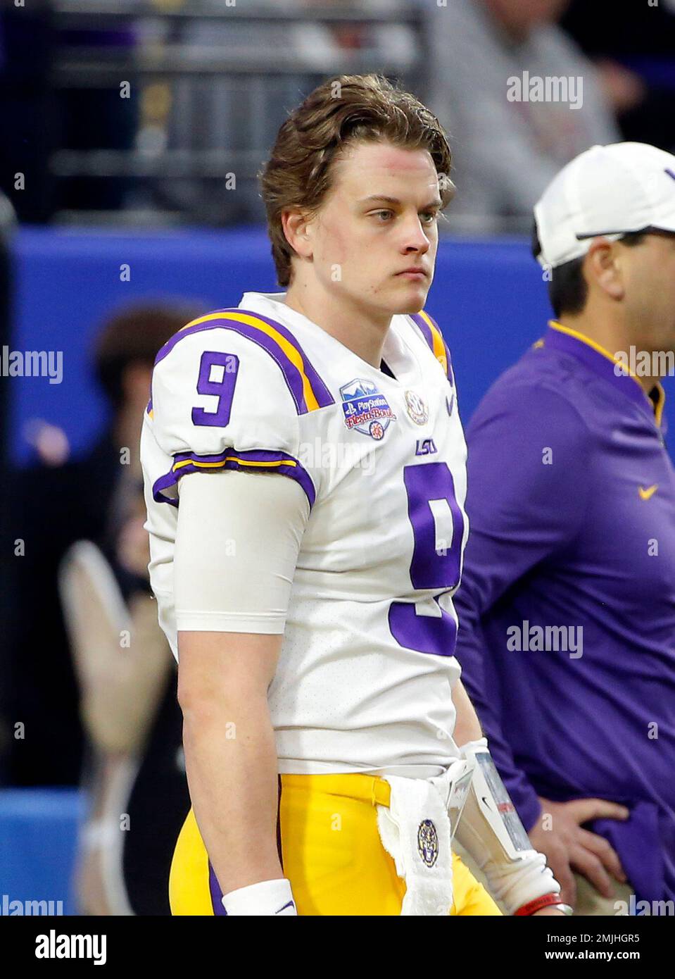 LSU quarterback Joe Burrow greets his parents, Joe and Robin Burrow, during  a celebration of their NCAA college football championship, Saturday, Jan.  18, 2020, on the LSU campus in Baton Rouge, La. (