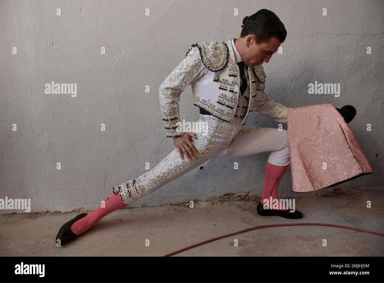 Spanish bullfighter Octavio Chacon warms up before entering the