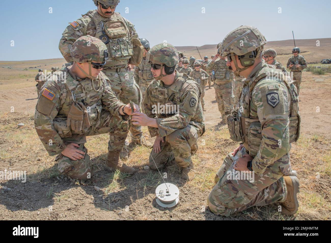 U.S. Army West Virginia National Guard Sgt. Brandon Glasscock (center), a combat engineer assigned to the 119th Sapper Company, demonstrates the sequence of detonation and how to safely operate the initiator to Pvt. Jonathon Ross, a combat engineer assigned to the 119th Sapper Company, during a demolition range held as their first training mission in accordance with Noble Partner located in the Vaziani Training Area, Georgia. Noble Partner is a cooperatively-led multinational training exercise in its sixth iteration between the Georgian Defense Forces (GDF) and U.S. Army Europe and Africa. The Stock Photo