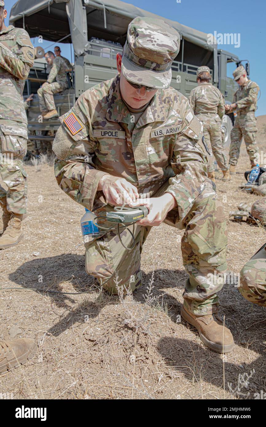 U.S. Army West Virginia National Guard Pvt. Blake Upole, a combat engineer assigned to the 119th Sapper Company, utilizes a Gregory Demolition Knot during a demolition range held as their first training mission in accordance with Noble Partner located in the Vaziani Training Area, Georgia. Noble Partner is a cooperatively-led multinational training exercise in its sixth iteration between the Georgian Defense Forces (GDF) and U.S. Army Europe and Africa. The exercise occurs at Vaziani and Camp Norio training areas in the country of Georgia from Aug. 29 to Sep. 9, 2022 Stock Photo
