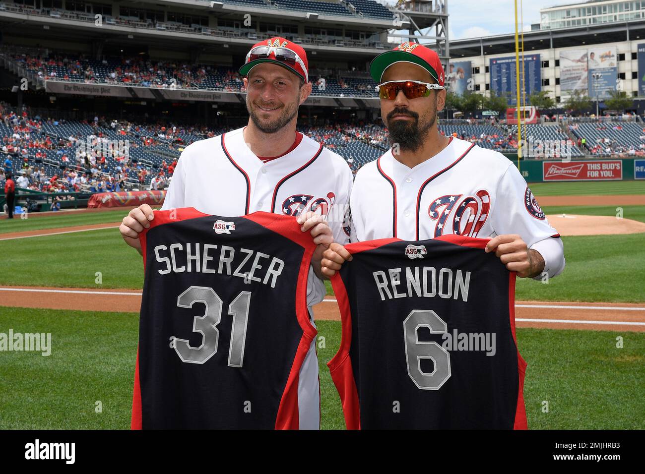 Washington Nationals' Max Scherzer, left, and Anthony Rendon, right, pose  with their All-Star jerseys before a baseball game against the Kansas City  Royals, Sunday, July 7, 2019, in Washington. (AP Photo/Nick Wass