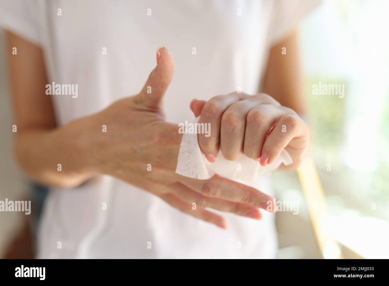 Woman cleans her hands close-up. Hand skin care. Stock Photo