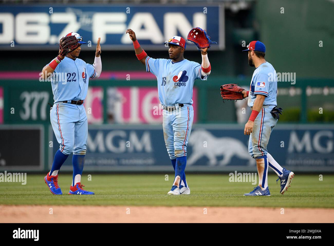Washington Nationals' Victor Robles (16), Juan Soto (22) and Adam Eaton,  right, celebrate after a baseball game against the Kansas City Royals,  Saturday, July 6, 2019, in Washington. The Nationals are paying