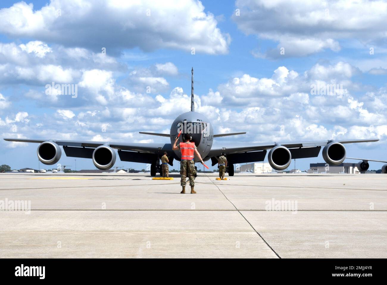 A 108th Wing maintainer marshals in a KC-135R at Joint Base McGuire-Dix-Lakehurst, N.J., Aug. 30, 2022. The aircraft carried home Guardsmen returning from a two month deployment at Andersen Air Force Base, Guam where they supported the Pacific Air Command flying operations. Stock Photo
