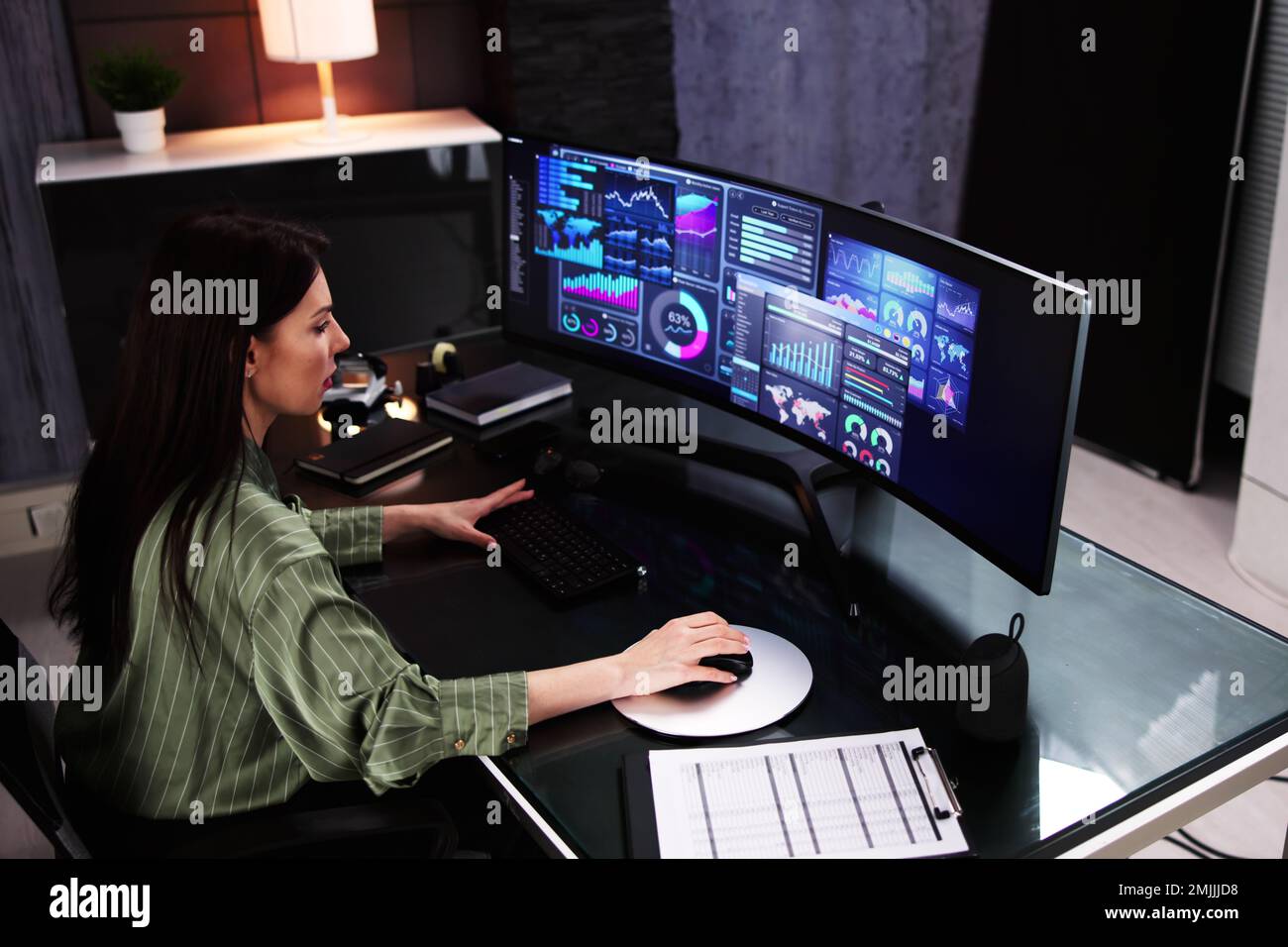 Business Woman Analyst Using KPI Data On Computer Stock Photo