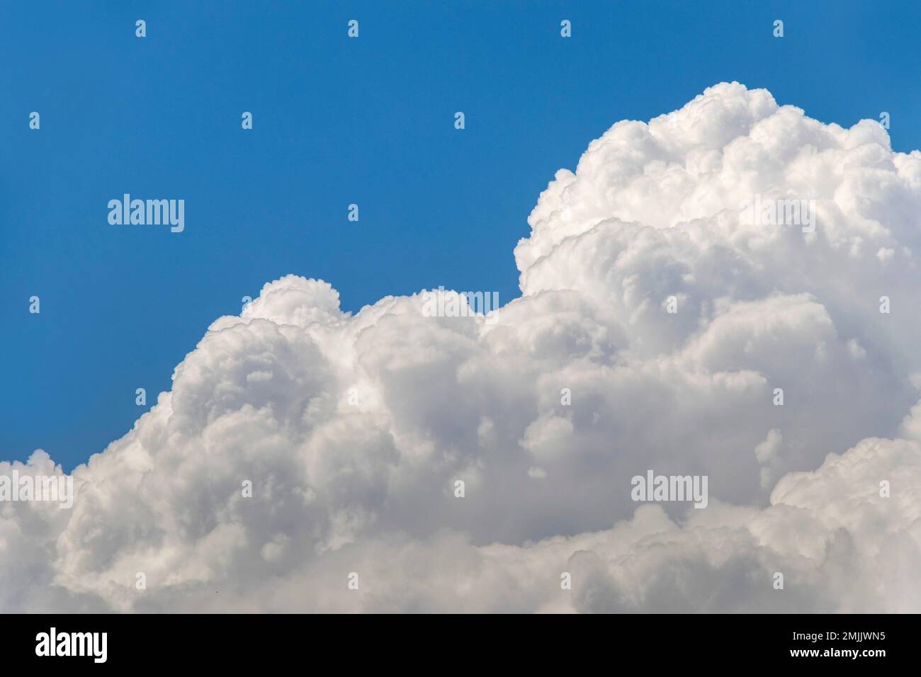 cloudy sky on a sunny day as a background Stock Photo - Alamy