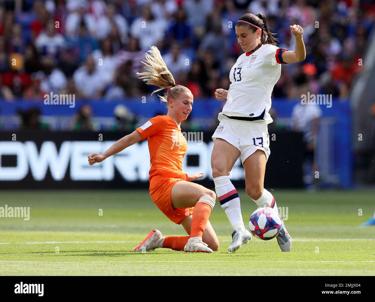 United States' Alex Morgan, right, is challenged by Netherlands' Jackie  Groenen during the Women's World Cup final soccer match between US and The  Netherlands at the Stade de Lyon in Decines, outside