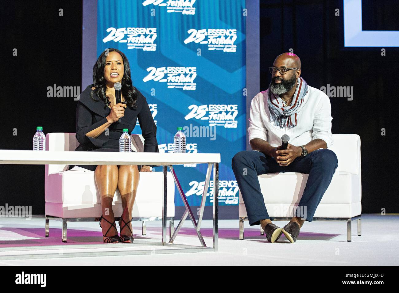 Michelle Ebanks, left, and Richelieu Dennis speak at the 2019 Essence  Festival at the Ernest N. Morial Convention Center on Saturday, July 6,  2019, in New Orleans. (Photo by Amy Harris/Invision/AP Stock