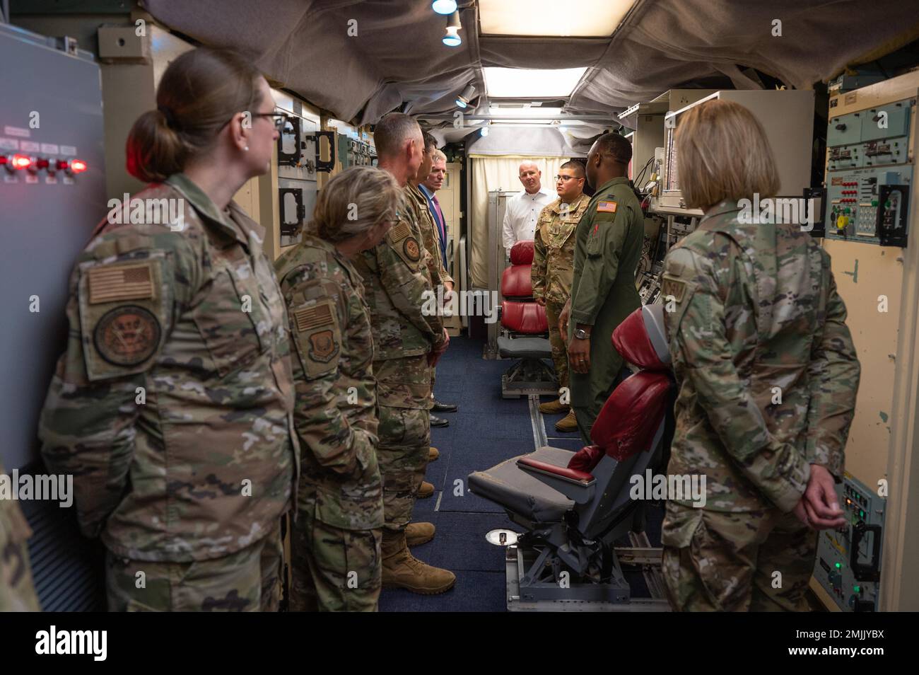 Service members and distinguished visitors tour a Missile Alert