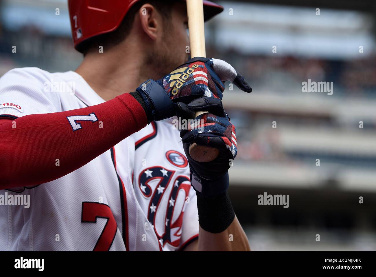 Washington Nationals' Trea Turner wears patriotic batting gloves