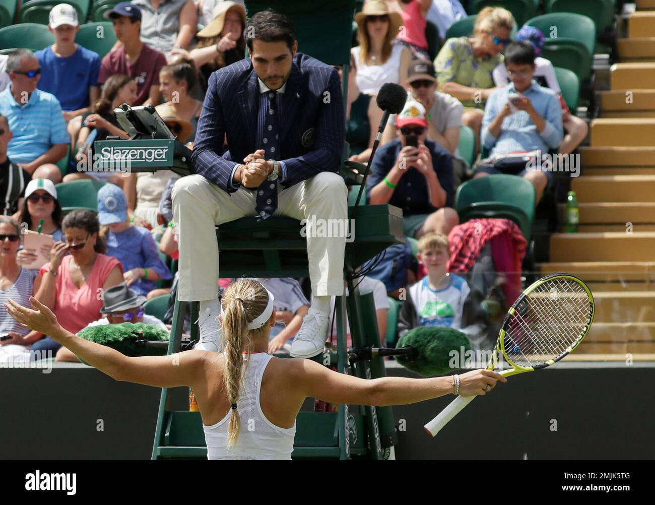 Denmark's Caroline Wozniacki remonstrates with umpire Nacho Forcadell