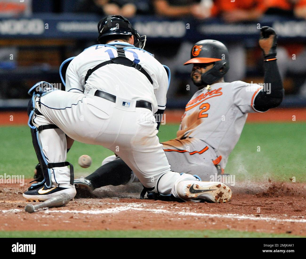 Tampa Bay Rays catcher Mike Zunino, left, drops the ball as