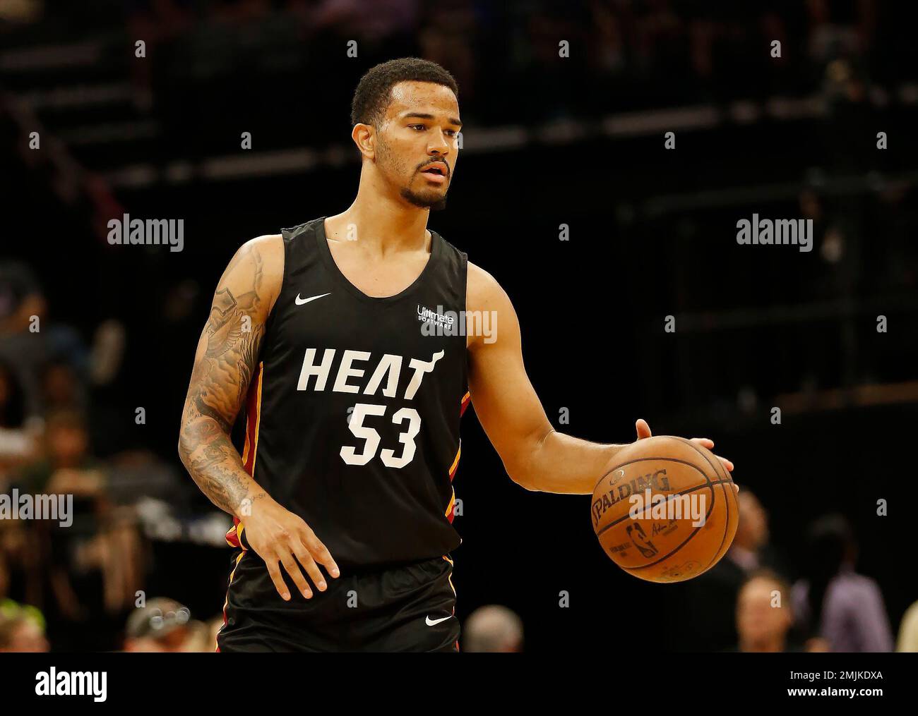 In this photo taken July 1, 2019, Miami Heat guard Nick Weiler-Babb  dribbles down court against the Los Angeles Lakers during the first half of  an NBA basketball summer league game in