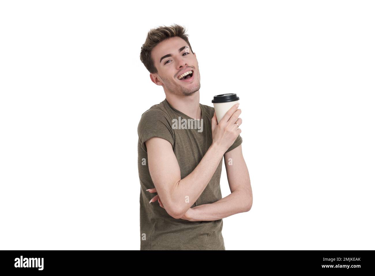 Young caucasian man laughing with a coffee cup, isolated. Stock Photo