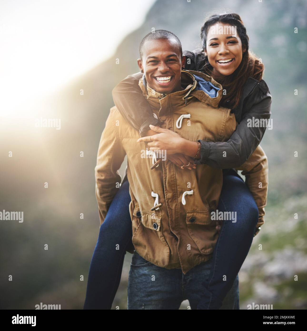 Real love makes time for fun. Portrait of a happy young couple having fun outside. Stock Photo