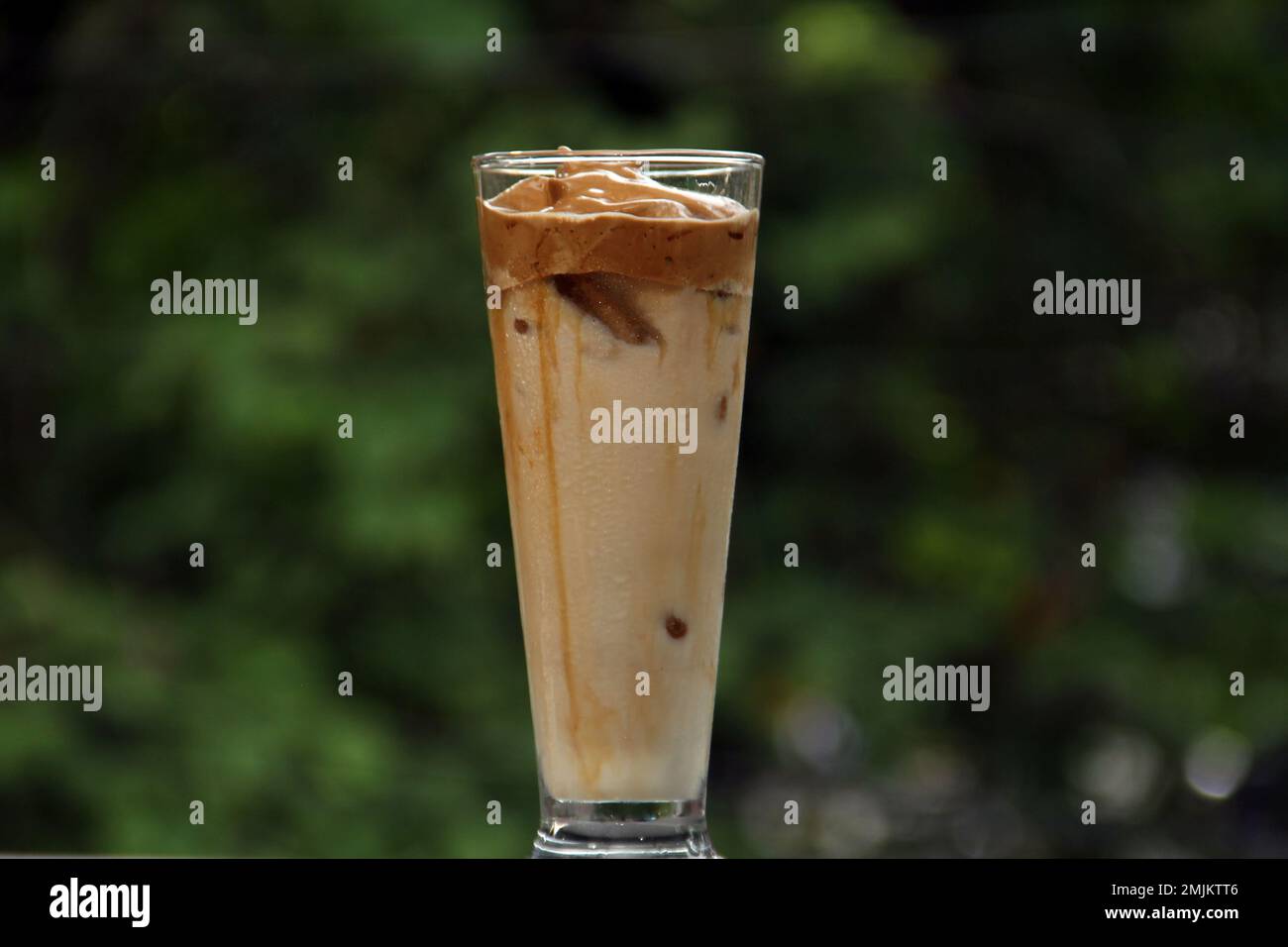 Dalgona Ice Coffee is a drink made by mixing equal parts instant coffee