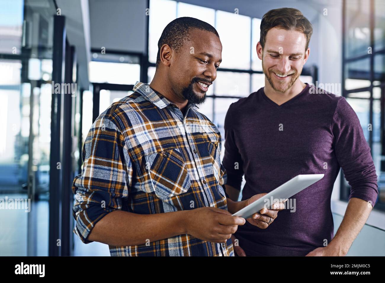 I like where were going with this...two designers working together in the office. Stock Photo