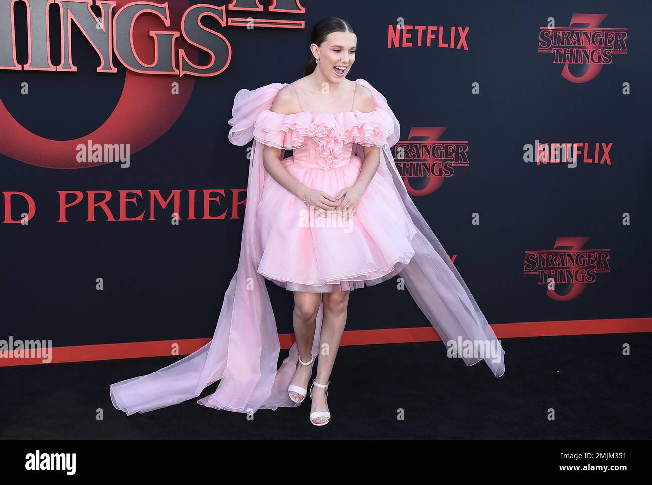 WESTWOOD, LOS ANGELES, CA, USA - OCTOBER 26: Actress Millie Bobby Brown  wearing a Calvin Klein dress arrives at the Los Angeles Premiere Of  Netflix's 'Stranger Things' Season 2 held at the