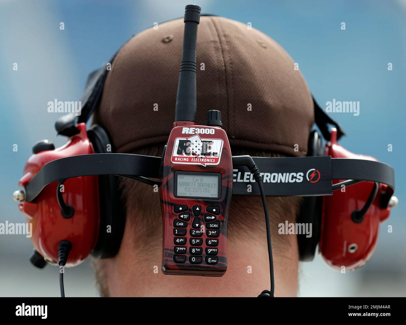 A NASCAR fan listens to his radio as he watches a NASCAR Xfinity Series auto race practice at Chicagoland Speedway in Joliet, Ill., Friday, June 28, 2019