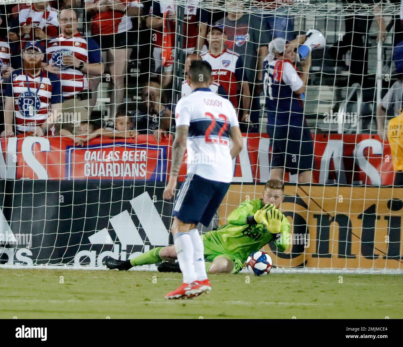 Vancouver Whitecaps' Erik Godoy (22) watches as goalie Zac MacMath