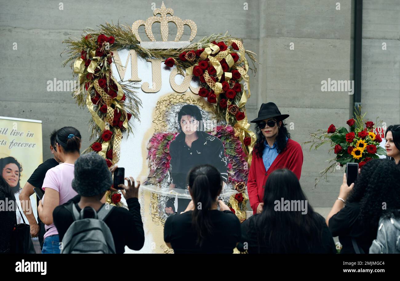 Michael Jackson impersonator Rem Garza of Long Beach, Calif., poses ...