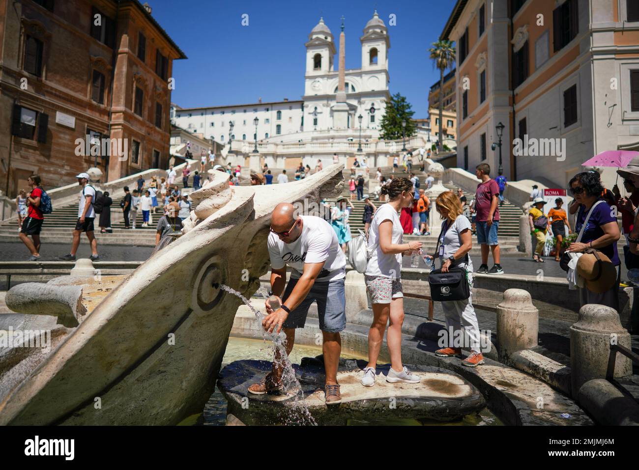Tourists cool-off in Bernini's 17th-century Barcaccia fountain, at the foot  of the Spanish Steps, in Rome, Tuesday, June 25, 2019. Authorities warned  that temperatures could top 40 C (104 F) in some