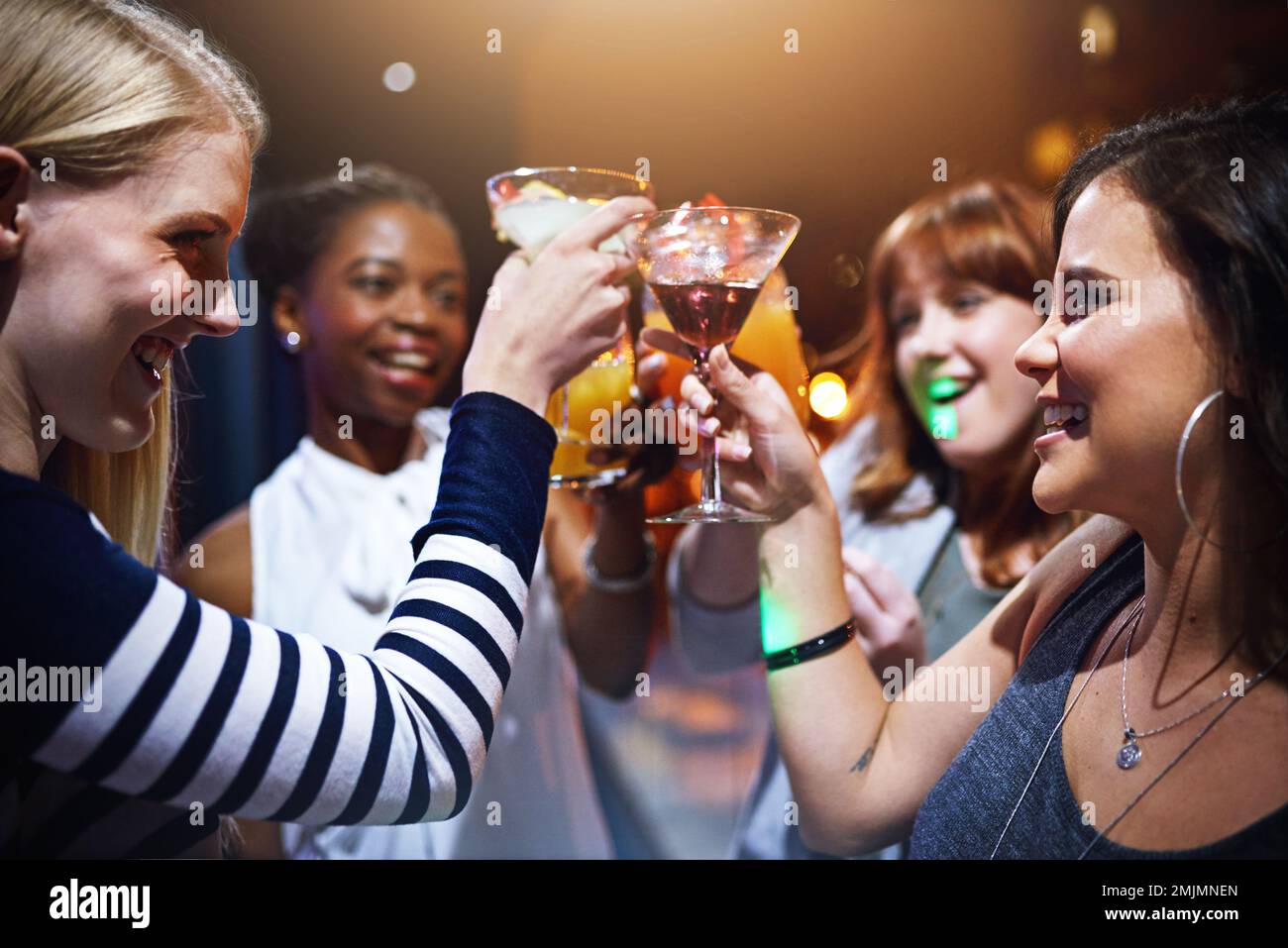 Cheers to the new year. a group of friends having drinks together at a party  Stock Photo - Alamy