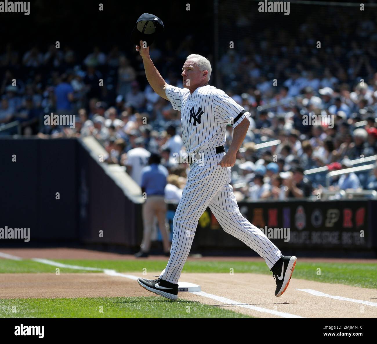 Former New York Yankee Scott Bradley is introduced during Old Timer's