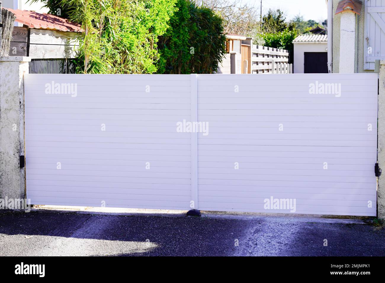 portal aluminium metal steel gate white home on suburb street house Stock Photo