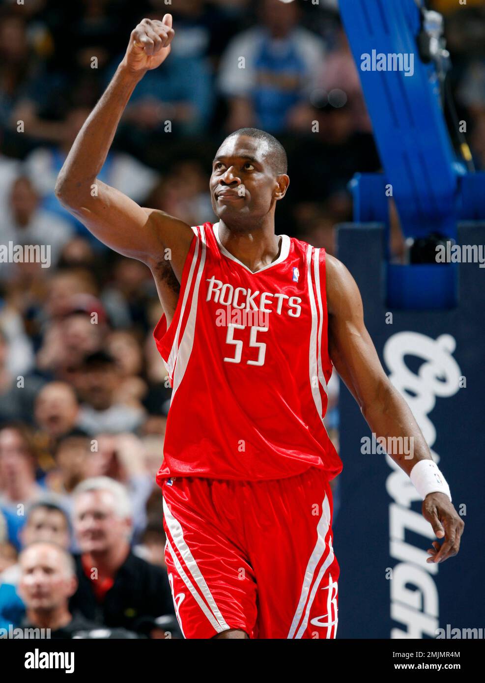 Houston Rockets center Dikembe Mutombo (C) of the Democratic