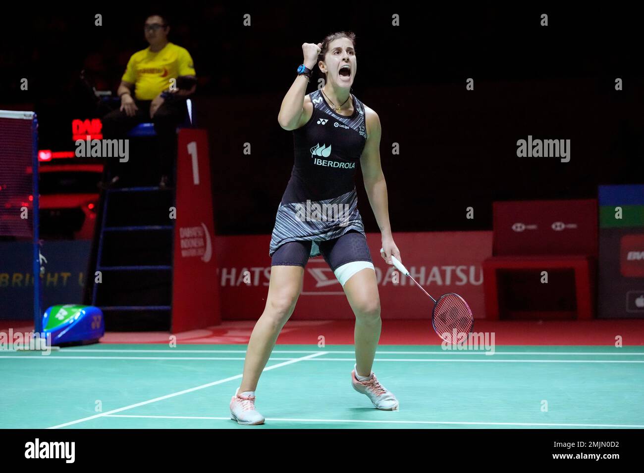 Spains Carolina Marin reacts after winning her semi final round of the womens singles match against Chinas Han Yue in the Indonesia Masters badminton tournament at the Istora Stadium in Jakarta, Indonesia,