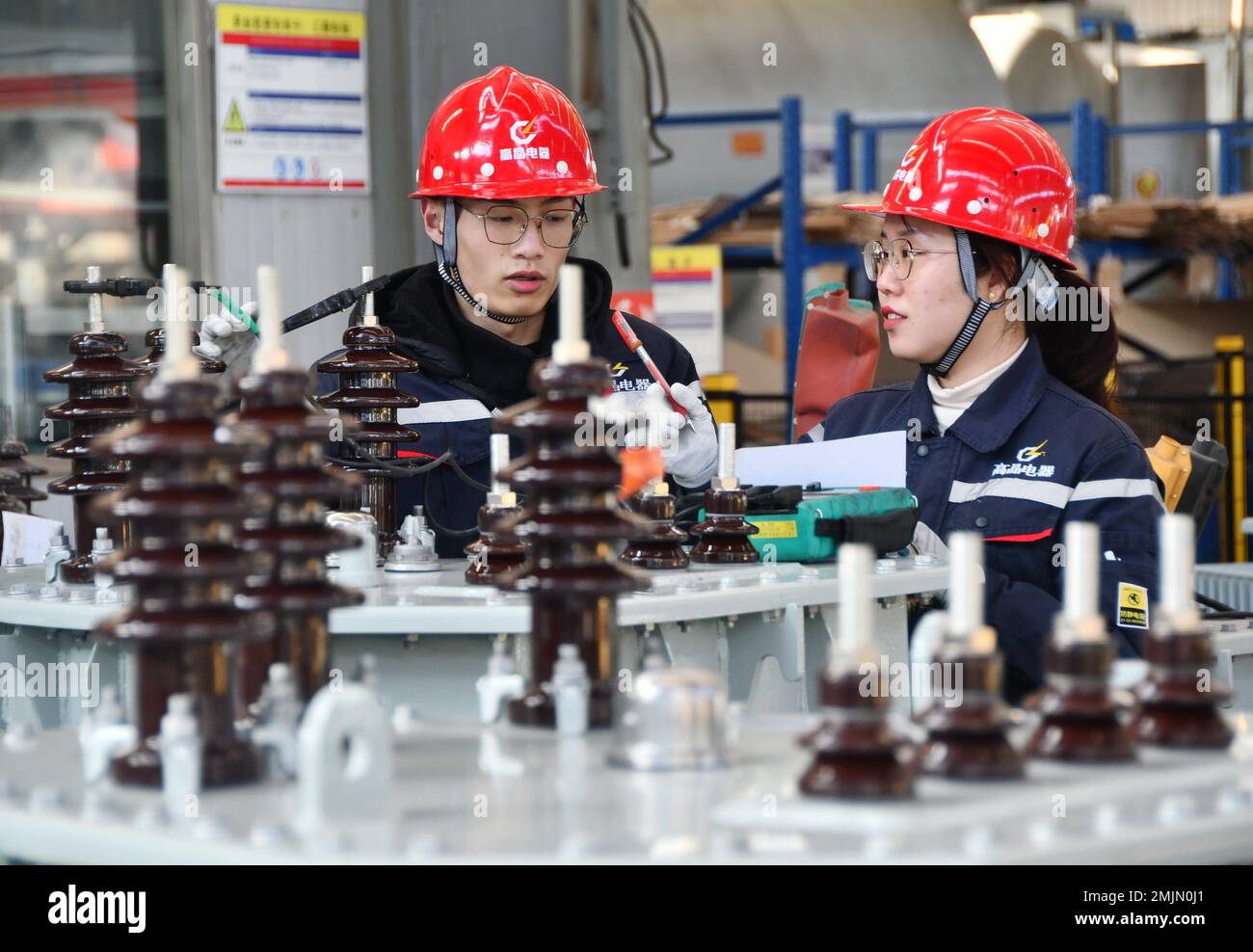 HANDAN, CHINA JANUARY 28, 2023 Workers test transformers at a