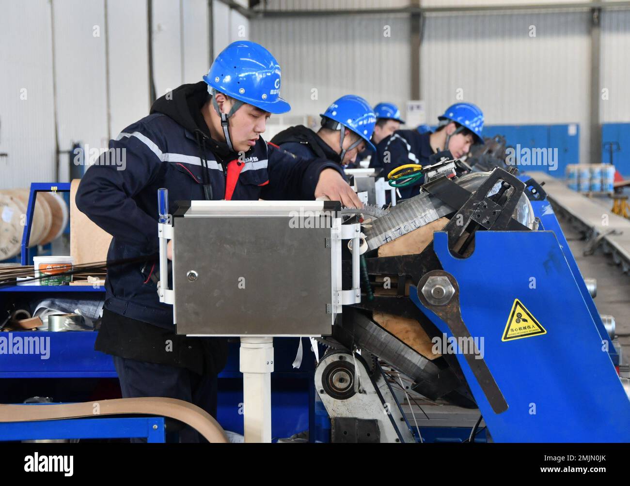 HANDAN, CHINA JANUARY 28, 2023 Workers assemble transformers at a