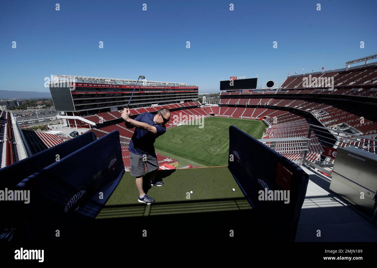 Troy Gilbert hits a golf ball toward a hole on the field at Levi's Stadium  during a Stadiumlinks event in Santa Clara, Calif., Saturday, June 22,  2019. Stadiumlinks is an event series