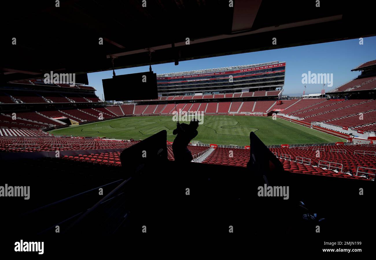 Andrew Luna hits a golf ball toward a hole on the field at Levi's Stadium  during a Stadiumlinks event in Santa Clara, Calif., Saturday, June 22,  2019. Stadiumlinks is an event series