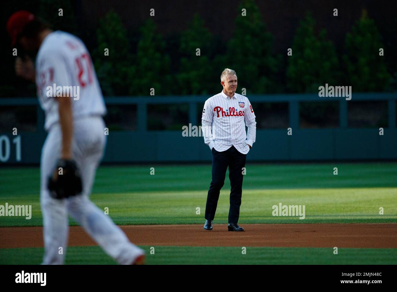 Former Philadelphia Phillies player Chase Utley throws a ceremonial first  pitch to actor Rob McElhenney, one of the creators of It's Always Sunny in  Philadelphia, before a baseball game between the Phillies