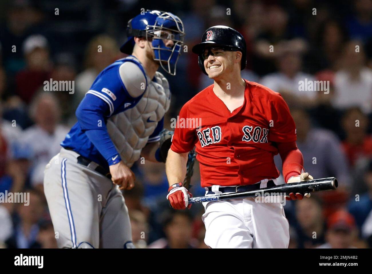 Boston Red Sox's Brock Holt, right, reacts beside Toronto Blue Jays' Danny  Jansen after striking out to end the ninth inning of a baseball game with  the score tied in Boston, Friday