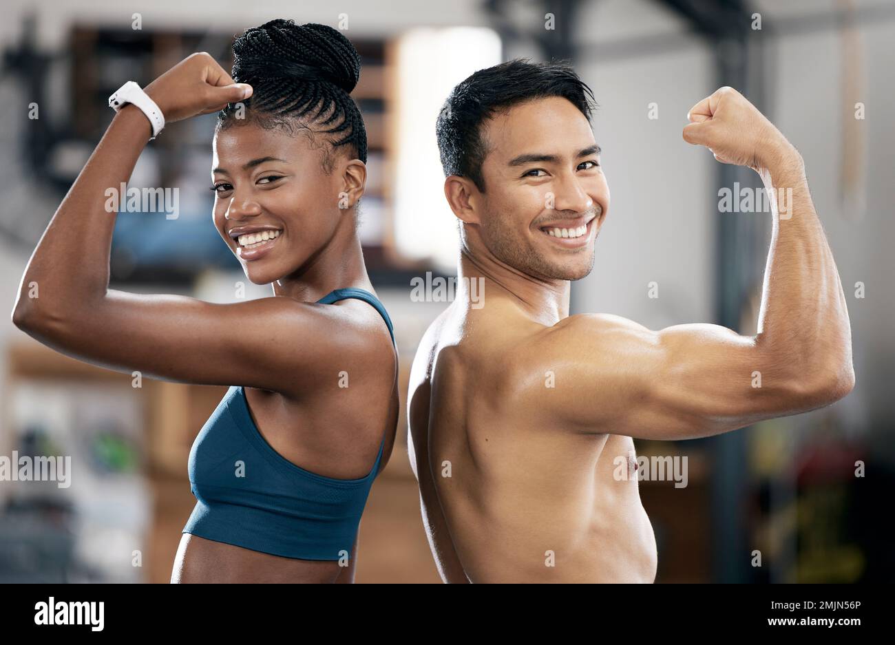 Portrait, black woman or coach flexing muscle or body goals in training or fitness exercise at gym. Coaching results, happy friends or healthy sports Stock Photo