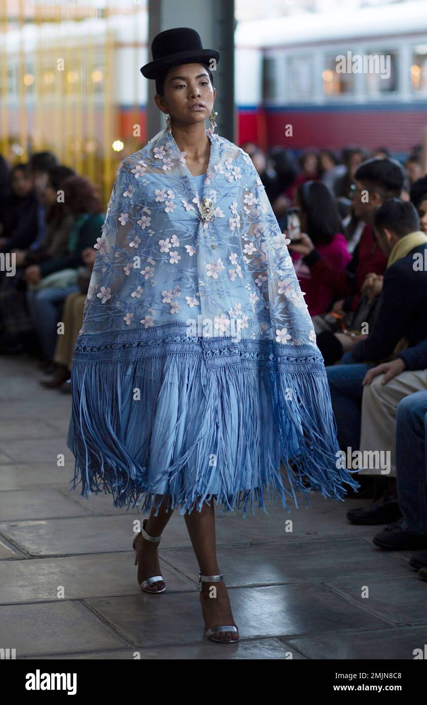 A model wears creations by Bolivian designer Pamela Santos during a Bolivia  Fashion Week show held inside an old train station in La Paz, Bolivia,  Thursday, June 20, 2019. (AP PhotoJuan Karita