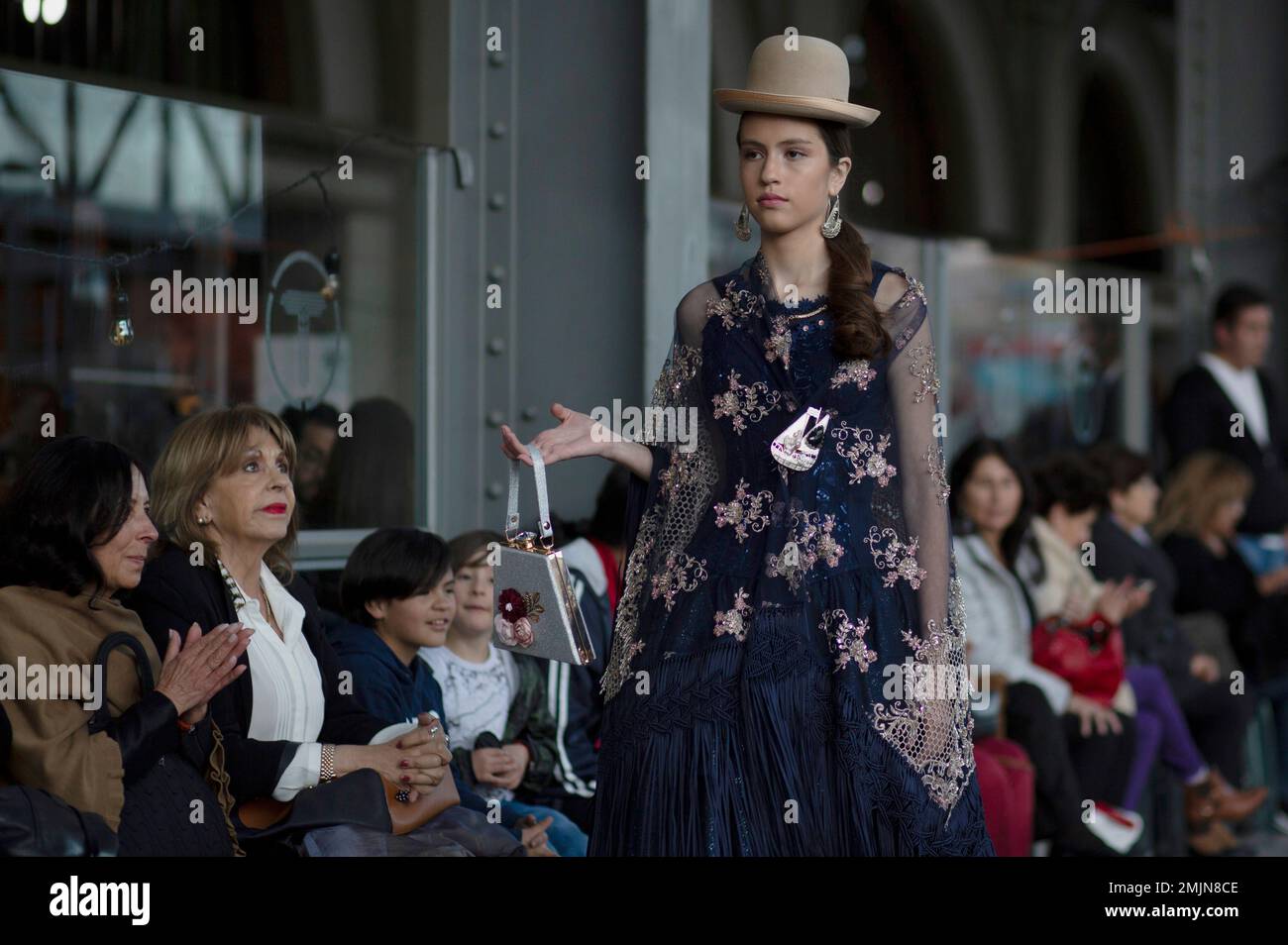 A model wears creations by Bolivian designer Pamela Santos during a Bolivia  Fashion Week show held inside an old train station in La Paz, Bolivia,  Thursday, June 20, 2019. (AP PhotoJuan Karita