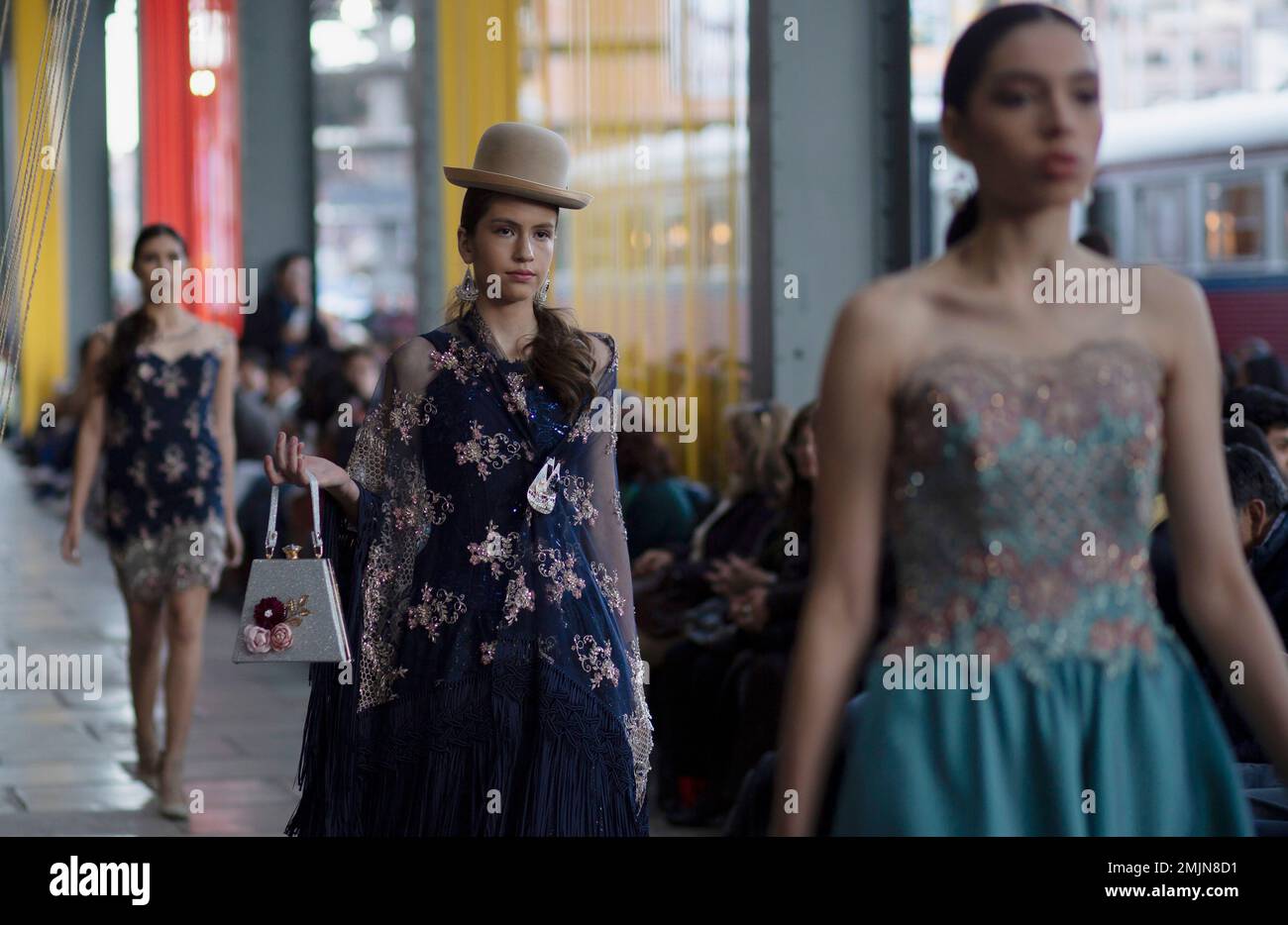 Models wear creations by Bolivian designer Pamela Santos during a Bolivia  Fashion Week show held inside an old train station in La Paz, Bolivia,  Thursday, June 20, 2019. (AP PhotoJuan Karita Stock