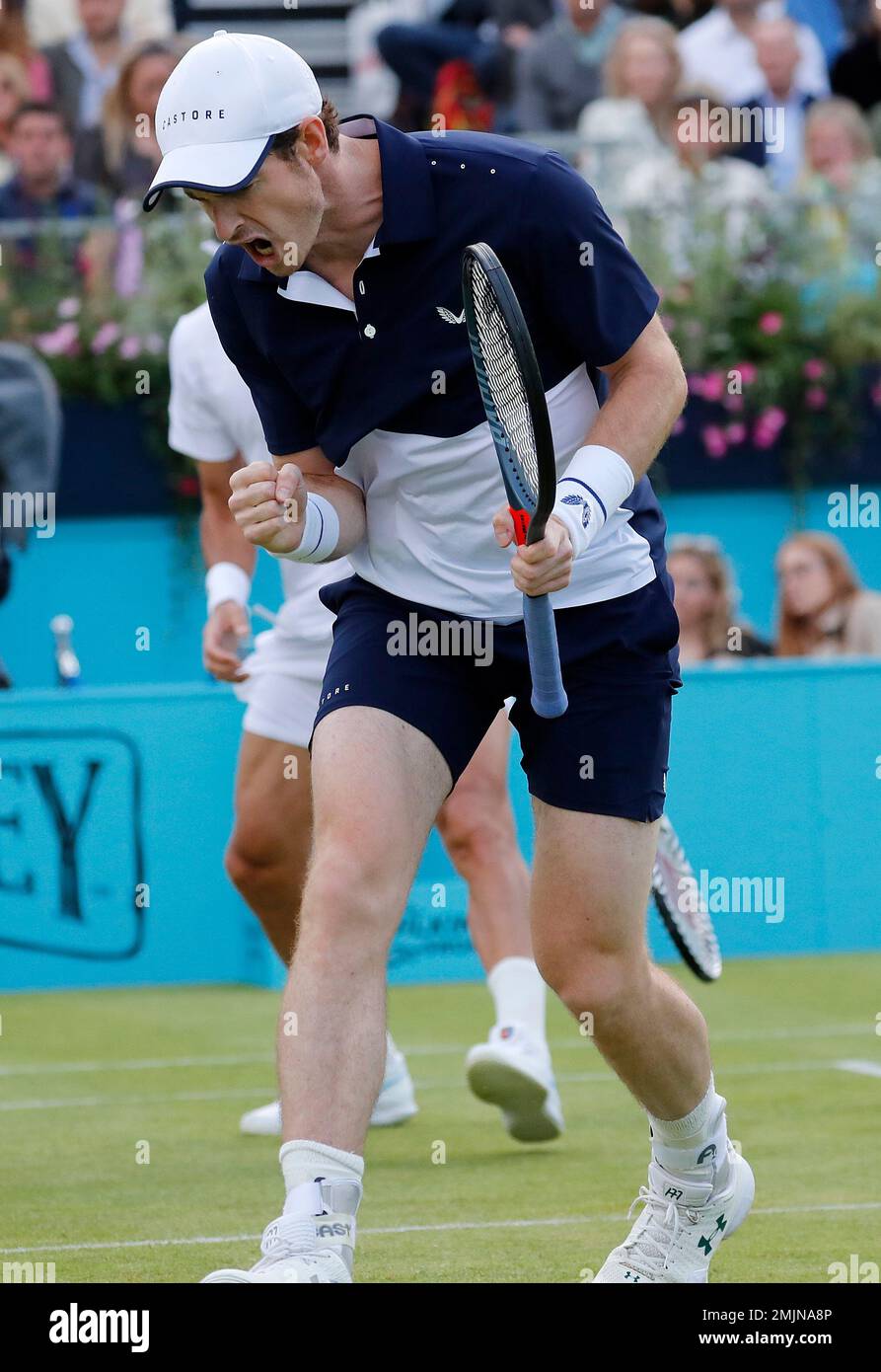 Andy Murray of Britain celebrates a point as he plays with Feliciano Lopez of Spain during their doubles match against Juan Sebastian Cabal and Robert Farah of Colombia at the Queens Club