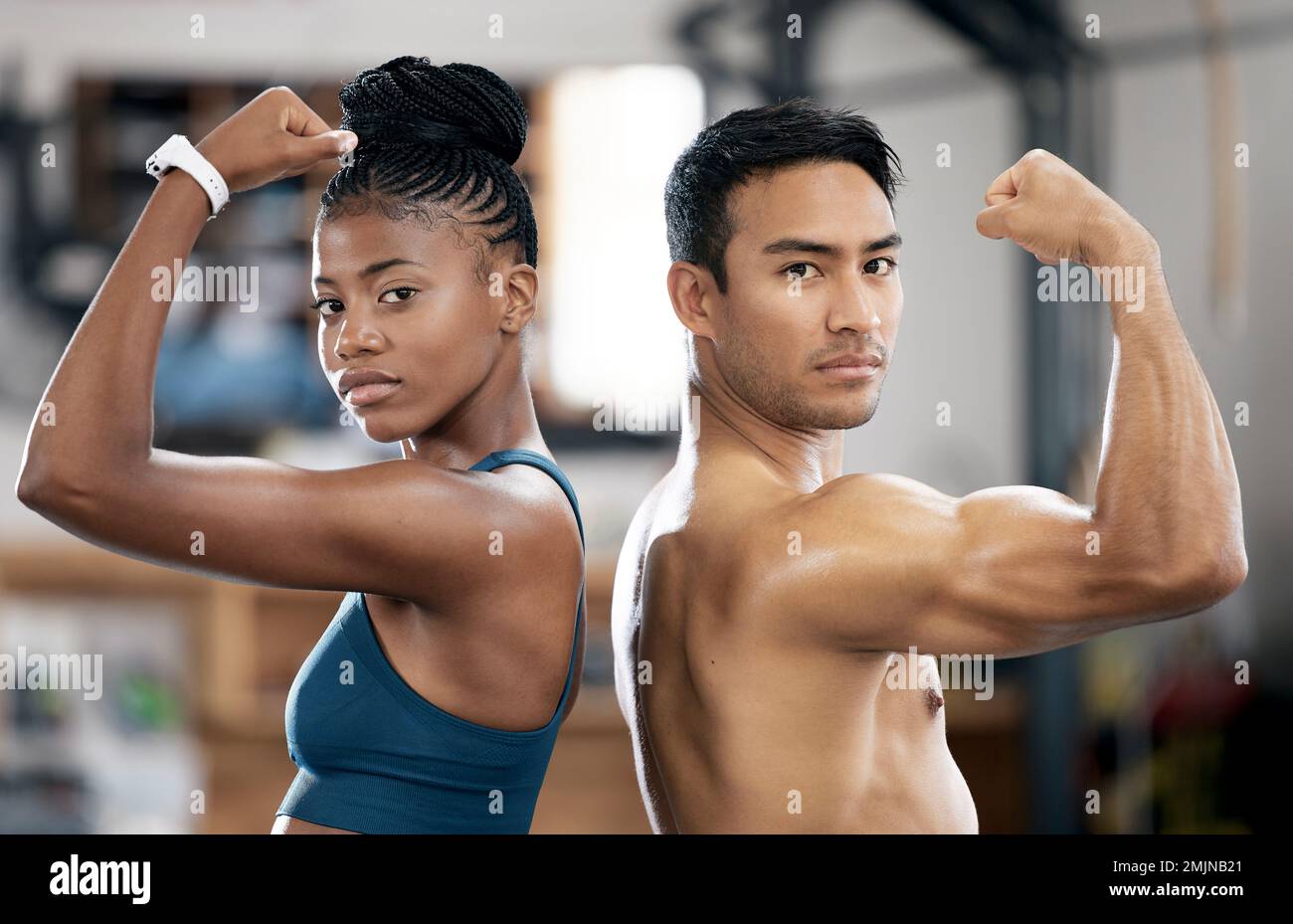 Portrait, black woman or personal trainer flexing muscles or body goals in training, workout or exercise. Fitness coaching, mindset or healthy Stock Photo