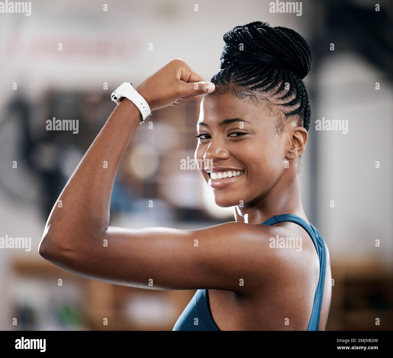 Portrait, fitness or black woman flexing muscle or body goals in training, workout or exercise at gym. Strong person, results or healthy African girl Stock Photo