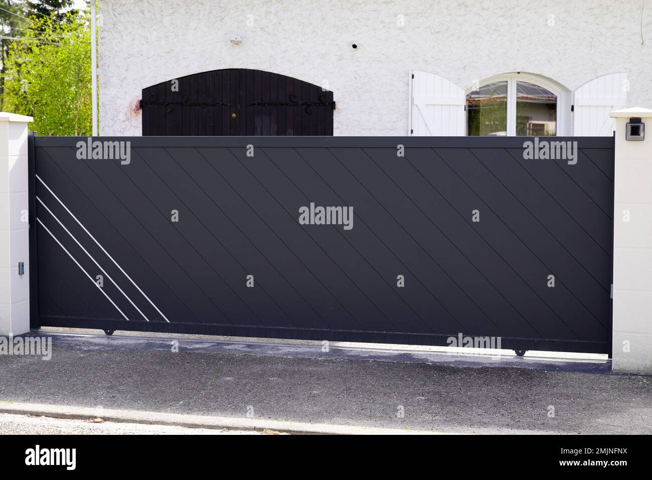 slide portal Aluminum gray paint metal gate house door of suburb home Stock Photo Alamy