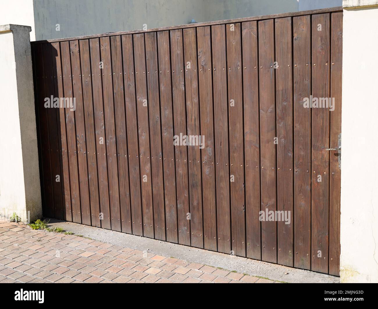 door wooden gate large design in street view outdoor home portal entrance Stock Photo